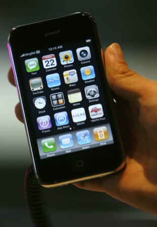 A user holds a smartphone as he checks the apps collection.