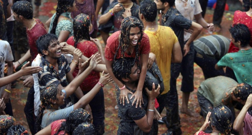 Revellers take part in a re-enactment of the traditional Spanish festival of La Tomatina