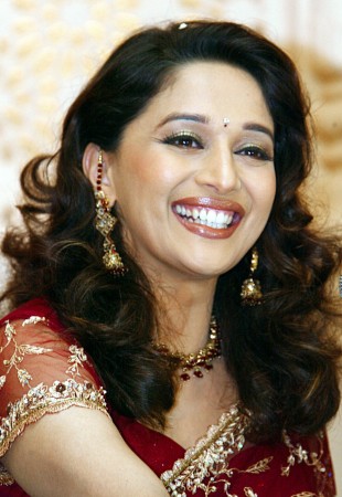 Madhuri Dixit, smiles during a press conference in New Delhi, July 12, 2002. Madhuri Dixit