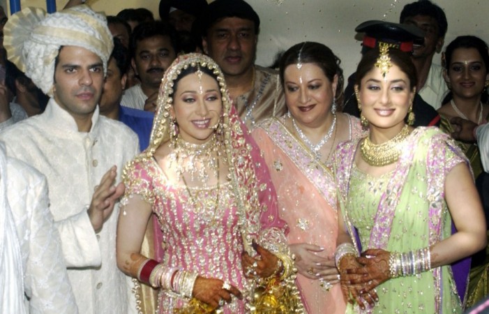Bollywood actress Karisma Kapoor (second from L) and Indian industrialist Sanjay Kapur (L) pose at their wedding Karisma Kapoor.