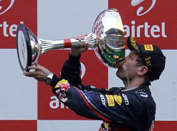 Kiss is sweet: Sebastian Vettel kisses the trophy Sebastian Vettel