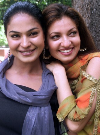 Pakistani actress Veena Malik (L) and her Indian counterpart Sheeba Bhakri pose for photographers during a news conference. Veena Malik (L) with Sheeba Bhakri