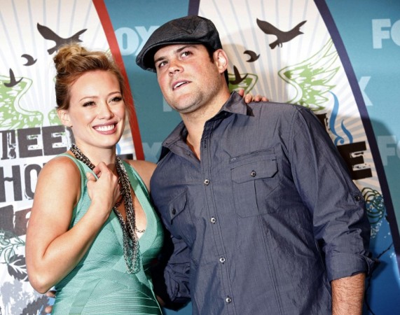 Actress and singer Hilary Duff and hockey player Mike Comrie pose in the press room at the Teen Choice 2010 Awards in Los Angeles
