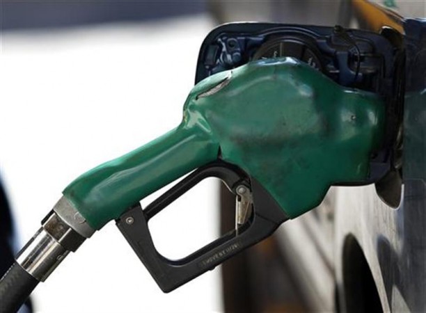 A gas nozzle is used to pump petrol at a station