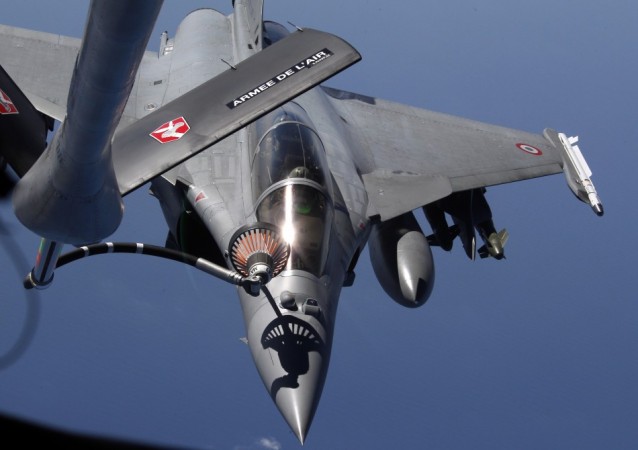 A French Rafale fighter jet refuels with an airborne Boeing C135 refuelling tanker aircraft from the Istres military airbase during a refuelling operation above the Mediterranean Sea March 25, 2011. Rafale