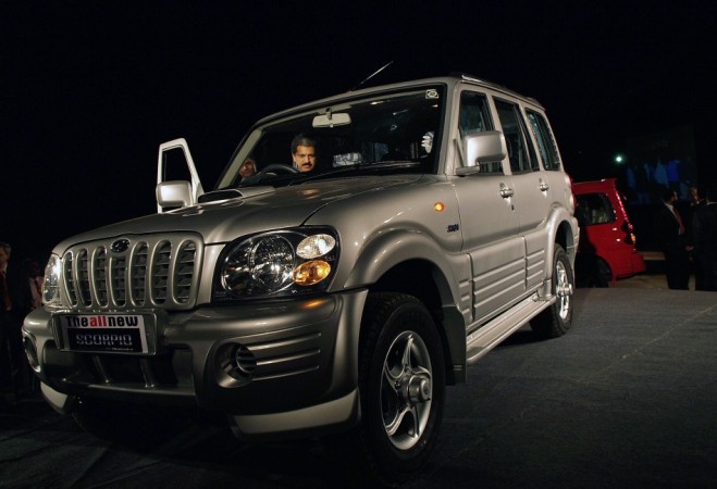 Vice chairman and managing director of Mahindra & Mahindra Ltd. Mahindra sits in newly launched SUV Scorpio in Nashik. Mahindra & Mahindra