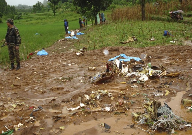 Aircraft debris is seen scattered at the Agni Air crash site in Shikharapur of Makwanpur near Kathamandu