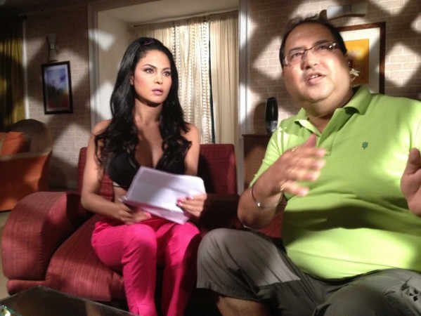 Veena Malik with director Navin Batra. Image:Scribes INC Veena Malik with director Navin Batra. Image:Scribes INC