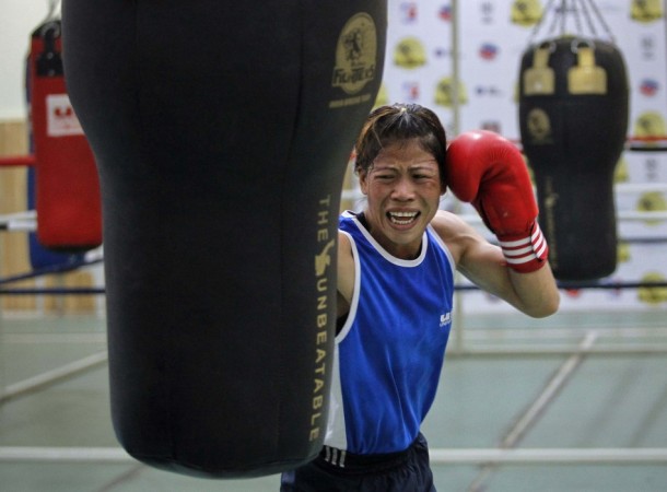 File picture shows India's boxer MC Mary Kom punching a bag during a training session in Pune Mary Kom