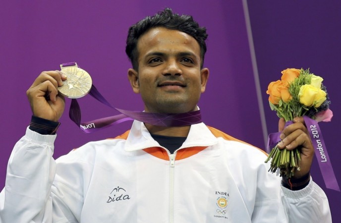 India's silver medal winner Vijay Kumar poses with his silver medal won in the men's 25m rapid fire pistol shooting event at the London 2012 Olympic Games India's silver medal winner Vijay Kumar poses with his silver medal won in the men's 25m rapid fire pistol shooting event at the London 2012 Olympic Games
