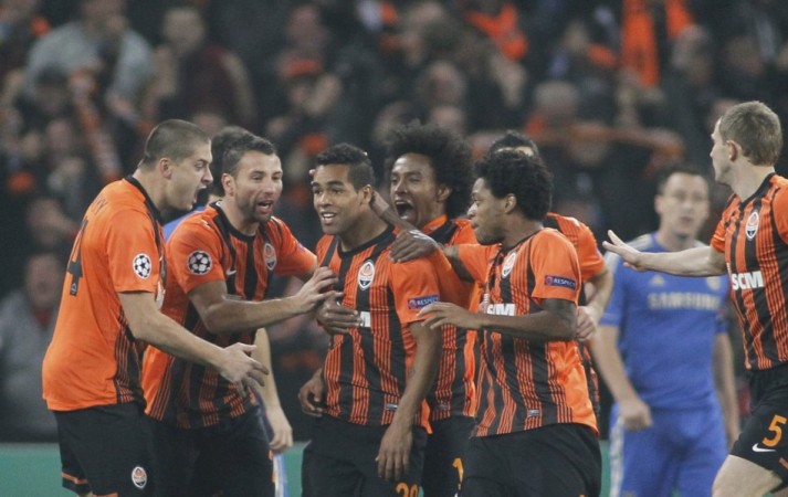Shakhtar Donetsk players celebrate against Chelsea.