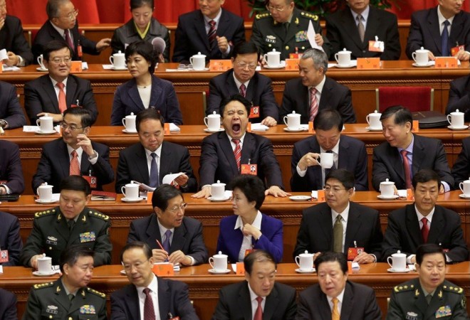 Delegates sit at the stage before the opening ceremony of 18th National Congress of the Communist Party of China at the Great Hall of the People in Beijing, November 8, 2012. 8th National Congress of the Communist Party of China