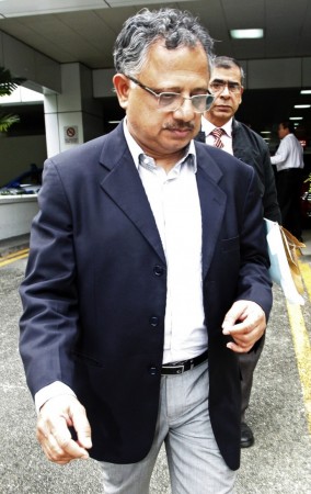 Two members of the medical team accompanying the Indian gang-rape victim leave Mount Elizabeth Medical Centre in Singapore