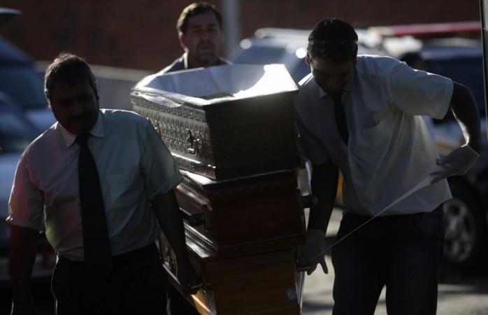 Funeral home workers arrive with empty coffins for victims of the fire at Boate Kiss nightclub before a collective wake in Santa Maria Funeral home workers arrive with empty coffins for victims of the fire at Boate Kiss nightclub before a collective wake in Santa Maria