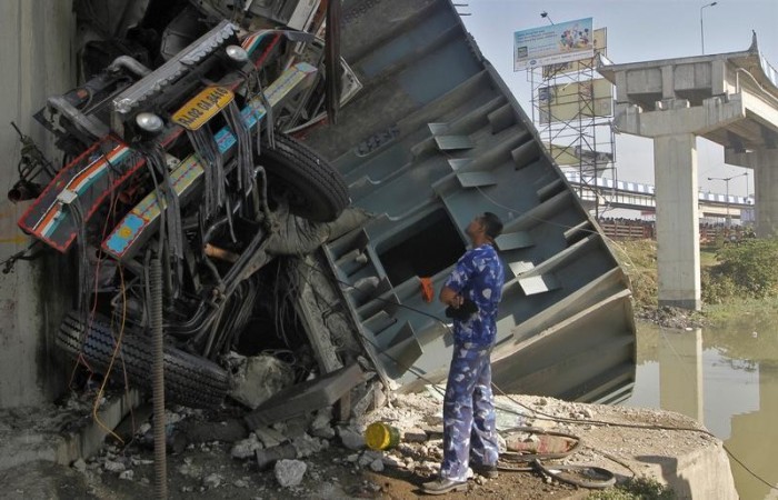 Three persons were injured when a major portion of the Ultadanga Flyover gave away in Kolkata on Sunday.