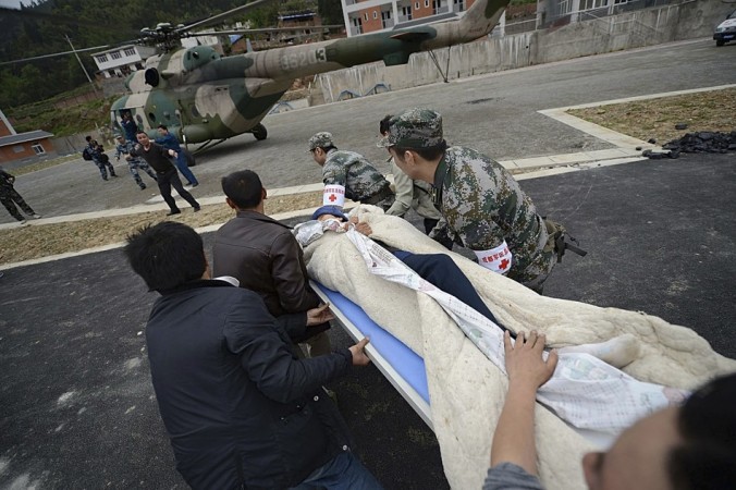 Rescuers rush to carry a victim onto a helicopter after a strong 6.6 magnitude earthquake hit Taiping town of Lushan county, Sichuan province April 20, 2013. (Reuters) Rescuers rush to carry a victim onto a helicopter after a strong 6.6 magnitude earthquake hit Taiping town of Lushan county, Sichuan province April 20, 2013. (Reuters)