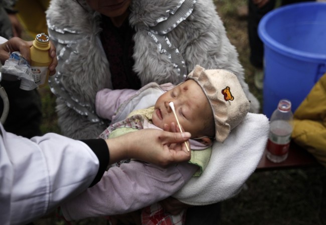 A three-month-old baby, whose mother was killed in a strong 6.6 magnitude earthquake, receives treatment at a medical point in Lushan county of Ya'an, Sichuan province April 21, 2013. (Reuters) A three-month-old baby, whose mother was killed in a strong 6.6 magnitude earthquake, receives treatment at a medical point in Lushan county of Ya'an, Sichuan province April 21, 2013. (Reuters)