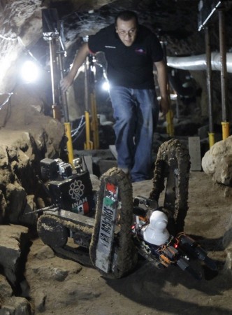 A robot used to explore ruins is seen on the entrance of a tunnel in the archaeological area of the Quetzalcoatl Temple near the Pyramid of the Sun at the Teotihuacan archaeological site, about 60 km (37 miles) north of Mexico City. (Credit: Reuters) A robot used to explore ruins is seen on the entrance of a tunnel in the archaeological area of the Quetzalcoatl Temple near the Pyramid of the Sun