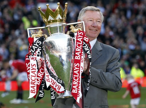 Manchester United's manager Alex Ferguson holds the English Premier League trophy following their English Premier League football match against Blackpool at Old Trafford, northern England, on 22 May, 2011 Alex Ferguson