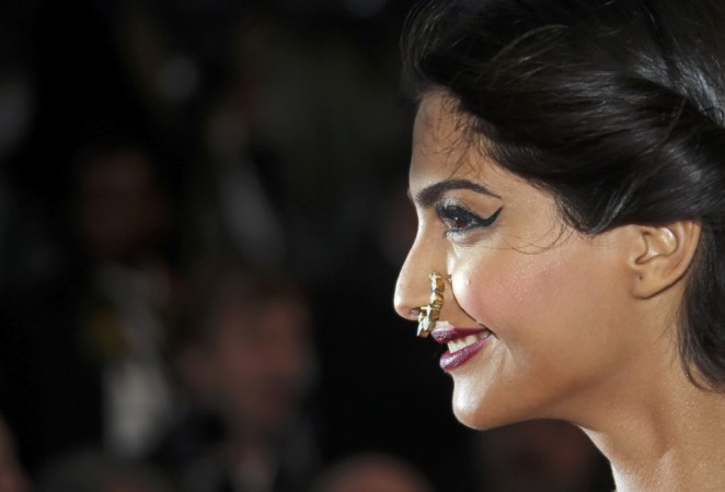Bollywood actress Sonam Kapoor poses on the red carpet as she arrives for the screening of the film 'The Great Gatsby' and for the opening ceremony of the 66th Cannes Film Festival in Cannes Sonam Kapoor