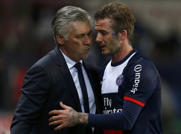 Paris Saint-Germain's Beckham hugs coach Ancelotti at the end of his team's French Ligue 1 soccer match against Brest at the Parc des Princes stadium in Paris David Beckham