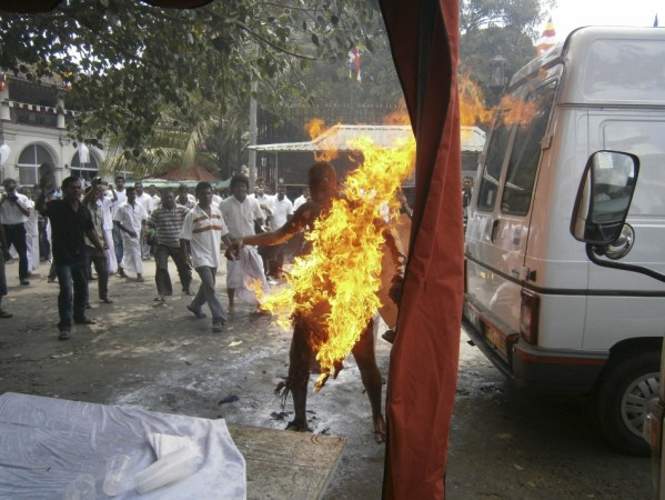 Sri Lankan Buddhist monk Bowatte Indaratane sets himself on fire in Kandy May 24, 2013. According to local media, the monk had set himself on fire in a form of protest against the slaughter of cattle. REUTERS/Stringer Buddhist monk