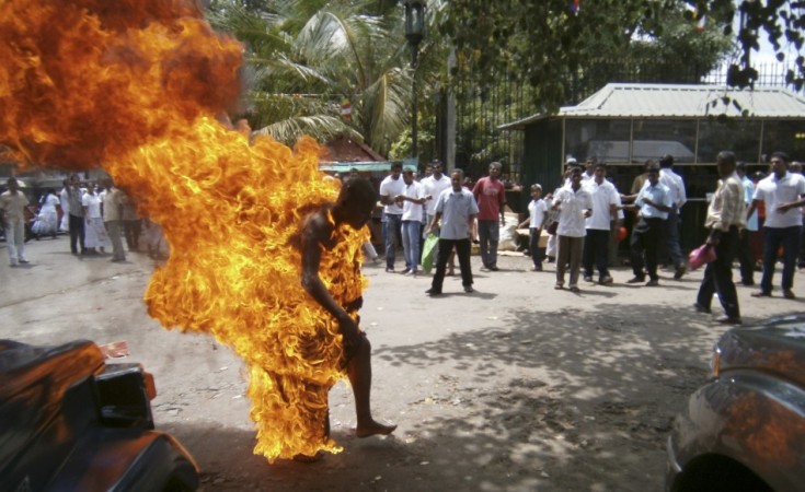 Sri Lankan Buddhist monk Bowatte Indaratane sets himself on fire in Kandy May 24, 2013. According to local media, the monk had set himself on fire in a form of protest against the slaughter of cattle. REUTERS/Stringer Buddhist monk