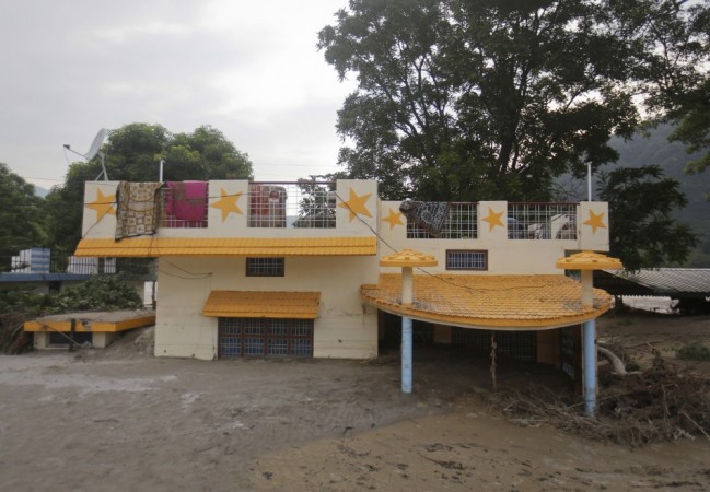A house submerged in sand due to floods in Srinagar, in the Himalayan state of Uttarakhand (Reuters) North India Flood