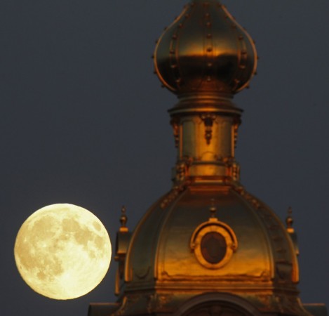 The moon rises behind the Peter and Pawel Fortress in St. Petersburg June 22, 2013. (Reuters) Supermoon 2013