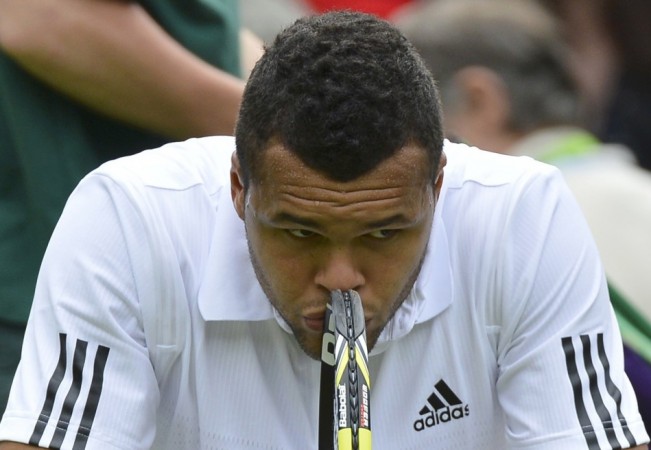 Jo-Wilfried Tsonga of France reacts as he sits in his seat after losing the second set in his men's singles tennis match against Ernests Gulbis of Latvia at the Wimbledon Tennis Championships, in London Jo-Wilfried Tsonga