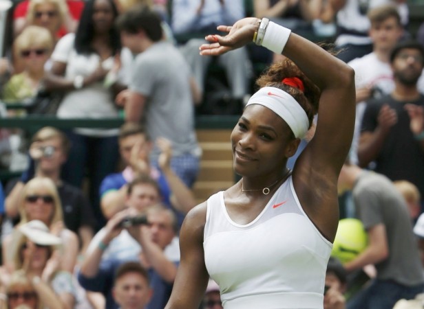 Serena Williams of the U.S. celebrates after defeating Mandy Minella of Luxembourg in their women's singles tennis match at the Wimbledon Tennis Championships, in London Serena Williams
