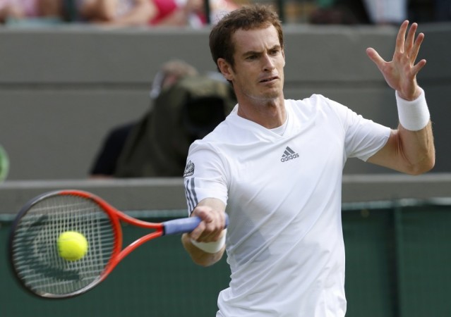 Andy Murray of Britain hits a return to Lu Yen-Hsun of Taiwan in their men's singles tennis match at the Wimbledon Tennis Championships, in London Andy Murray