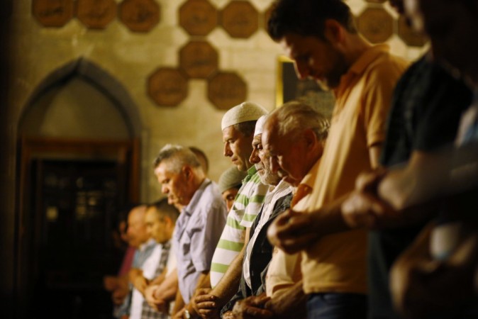 Muslims attend an evening communal prayer session called Ramadan