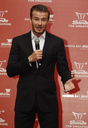 Beckham addresses crowd at the Guardian Academy in Singapore David Beckham