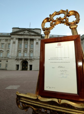 A notice formally announcing the birth of a son to Britain's Prince William and Catherine, Duchess of Cambridge, is placed in the forecourt of Buckingham Palace, in central London Royal Baby