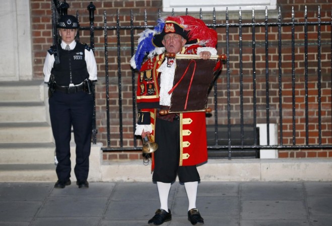 A town crier announces the royal birth outside the Lindo Wing of St Mary's Hospital after Catherine, Duchess of Cambridge gave birth to a baby boy in central London Royal Baby