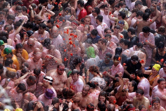 Revellers battle with tomatoes during the annual La Tomatina Festival 2013