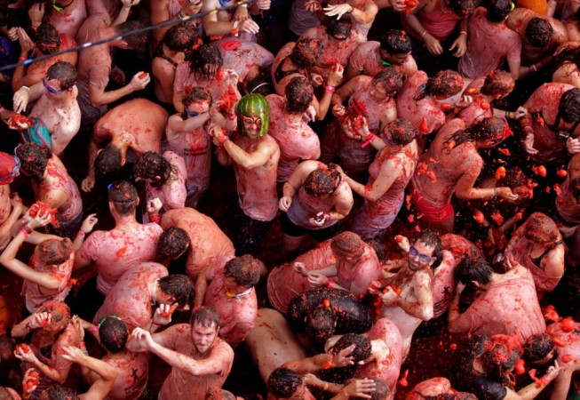 Revellers battle with tomatoes during the annual La Tomatina Festival 2013