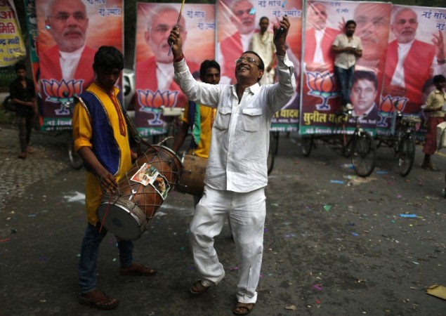 A supporter of BJP celebrates before Narendra Modi was crowned the party's prime ministerial candidate in New Delhi BJP supporter