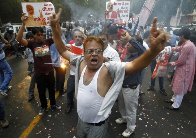 BJP supporters dance before Narendra Modi was crowned BJP's prime ministerial candidate in New Delhi BJP supporters