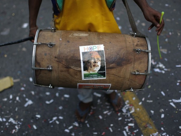 An image of Narendra Modi is seen on drum before he was crowned BJP's prime ministerial candidate in New Delhi BJP supporter