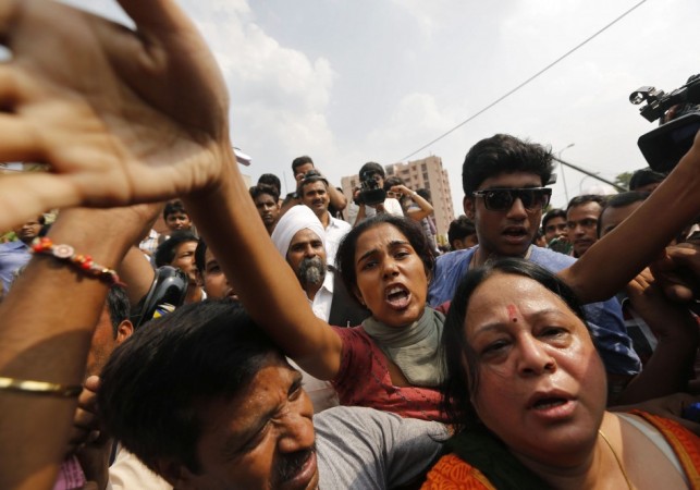 Protesters shout slogans outside a court in New Delhi Delhi gang-rape case
