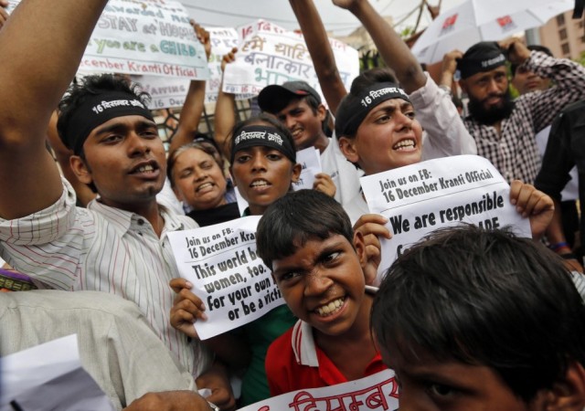 Protesters shout slogans outside a court in New Delhi Delhi gang-rape case