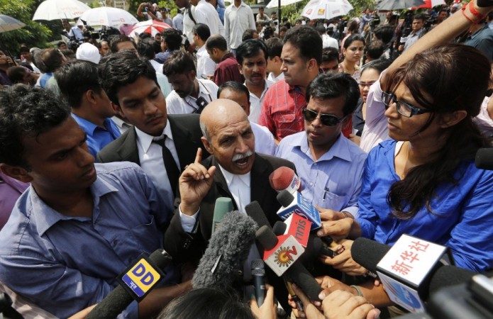 V.K. Anand, defence lawyer for one of the four men who were found guilty of the fatal gang-rape of a young woman on a bus in New Delhi, speaks with the media after the verdict in New Delhi Delhi gang-rape case