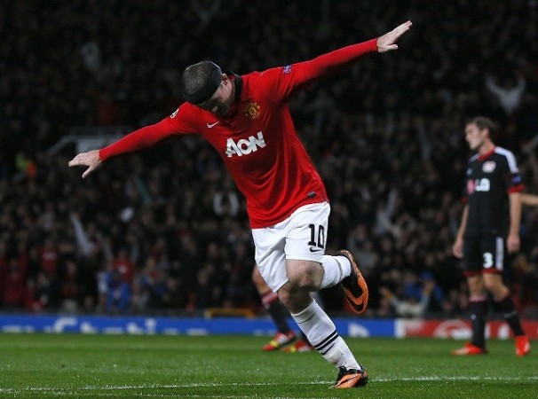 Wayne Rooney celebrates after scoring against Bayer Leverkusen in the Champions League