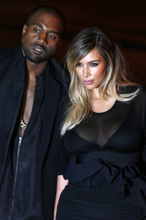 Kanye West and Kim Kardashian arrive at the Givenchy Spring/Summer 2014 women's ready-to-wear fashion show during Paris Fashion Week Kim Kardashian, Kanye West