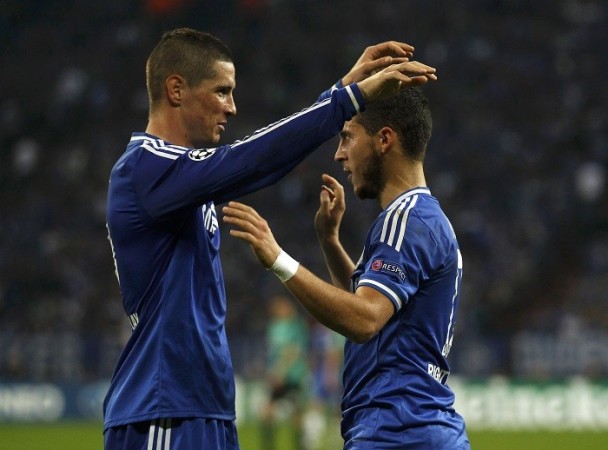 Chelsea players Fernando Torres and Eden Hazard celebrate a goal against Schalke in the Champions League. Reuters Chelsea Torres Hazard