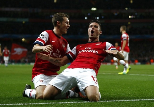 Arsenal striker Olivier Giroud celebrates his goal against Borussia Dortmund with Aaron Ramsey. Reuters Giroud Arsenal Ramsey