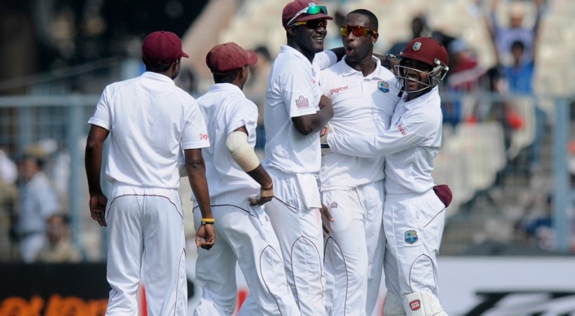 West Indies spinner Shane Shillingford celebrates with teammates after dismissing India opener Murali Vijay. BCCI Official Website Shillingford West Indies
