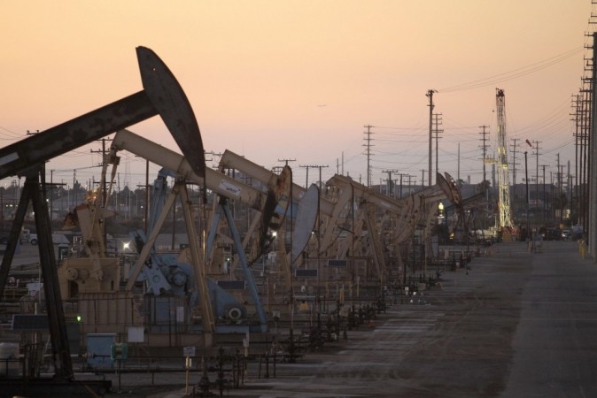 Oil rig pumpjacks, also known as thirsty birds, extract crude from the Wilmington Field oil deposits area where Tidelands Oil Production Company, which is owned by Occidental Petroleum Corporation operates near Long Beach, California in this July 30, 2013